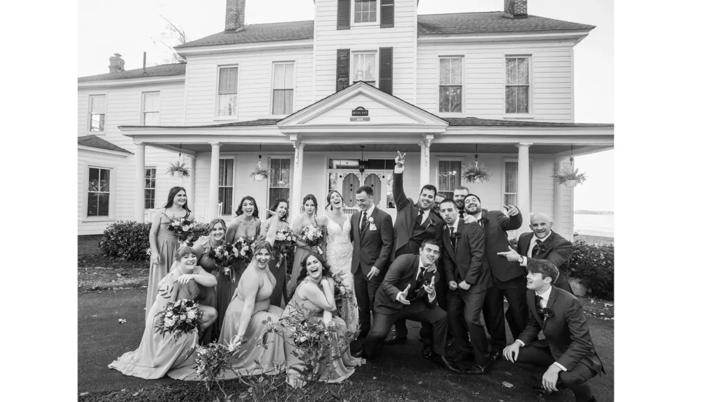 Wedding party is shown in front of Southern Maryland Wedding Venue Lower Notley Farm 