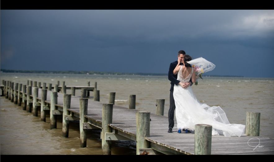 A firstlook between bride and groom at Herrington on the Bay at Herrington Harbour before their Maryland waterfront wedding